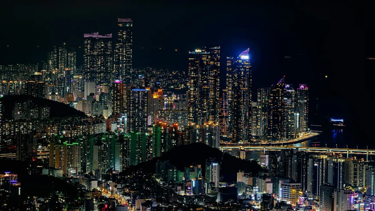 city with high rise buildings during night time